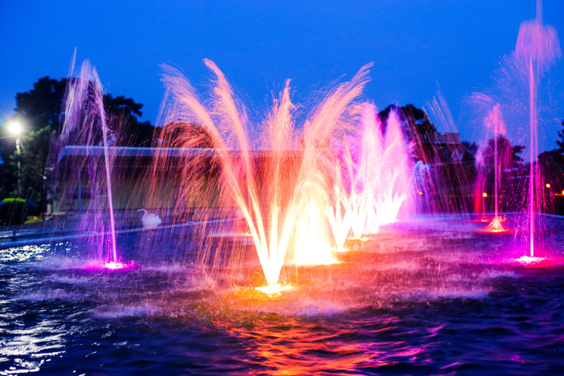 Illuminated fountain jets at Maya Nature Resort.