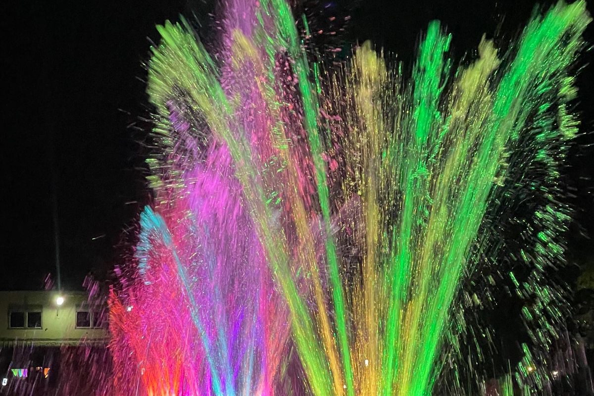The dancing fountain lit in green and pink at Maya Nature Resort.