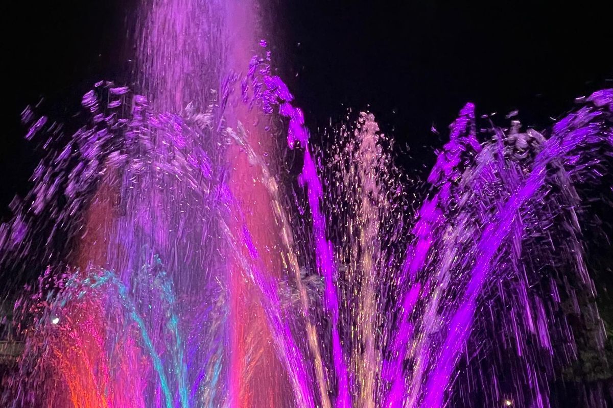 The dancing fountain lit in purple at Maya Nature Resort.